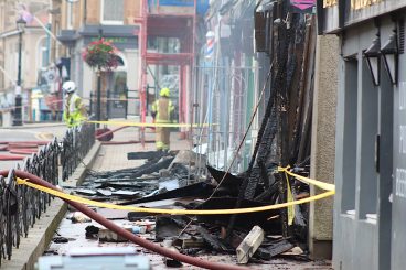 Two charged after town centre fire