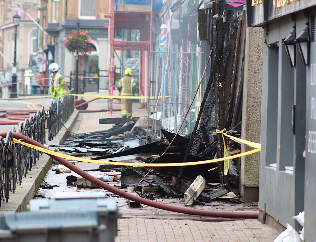 Two charged after town centre fire